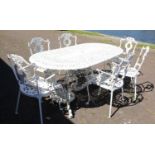 A substantial painted white cast metal garden table 187cm x 95cm together with a set of six matching