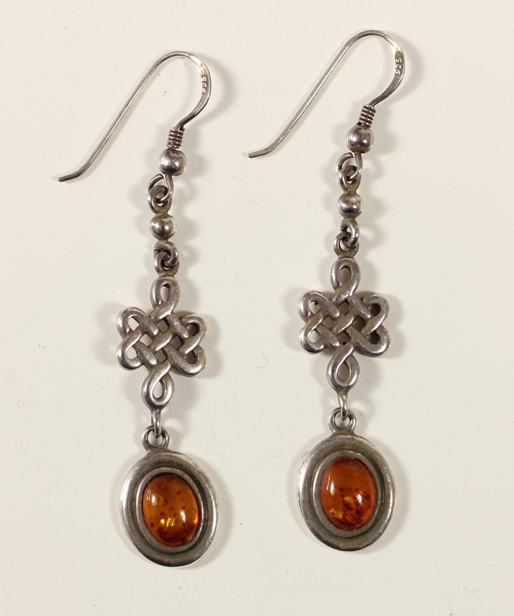 A silver and amber pendant, bracelet with matching ear rings and two pairs of ear rings - Image 5 of 7