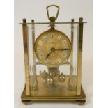 A Kern, brass, square anniversary clock, with beveled front glass panel, 19 cm