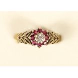 A 9ct gold ruby and diamond cluster ring, 2.6gm, N