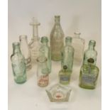 A collection of early 20th Century advertising pop bottles some of local interest, together with a