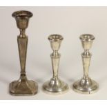 A pair of silver tapering candlesticks, Birmingham 1972, 14.5cm, loaded and another loaded