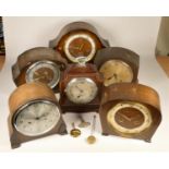 A collection of clocks to include, six oak cased mantel clocks