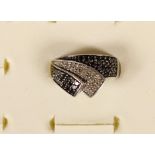 A 9ct white gold and black and white diamond dress ring, stated weight 0.50cts, 4.3gm, L