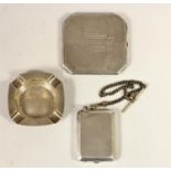 A silver powder compact, Birmingham 1933, mirror but no powder, a silver ashtray, vesta case and