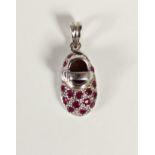 A 14K white gold and ruby shoe pendant, 1.9gm