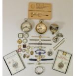 A collection of pocket watches, wristwatches and watch faces