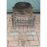 A heavy cast iron fire grate/ fire basket, complete with fireside dogs. 52cm wide, 35cm deep, 58cm