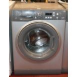 A Hotpoint Aquarius washing machine in silver, model WMAQF 721 7K A+ 59cm wide, 51cm deep.