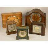 A collection of clocks to include, mid 20th Century mantle clocks, a oak cased Westminster chime, an