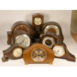 A collection of clocks to include, an 8 day wooden mantel clock, a Smiths Enfield clock, a Comitti