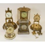 A collection of clocks to include, manual wind anniversary clocks and a manual wind mantel clock
