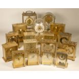 A collection of clocks to include, a Rhythm quartz anniversary clock, Acctim quartz carriage