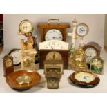 A collection of clocks to include, a marble Xavier quartz mantel clock, a Swiza 8 day clock,