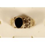 A 9ct gold and onyx abstract ring, 7.5gm, U.