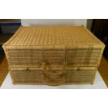 A large wicker traveling trunk together with a pair of wooden cantilever 4 tier sewing boxes,