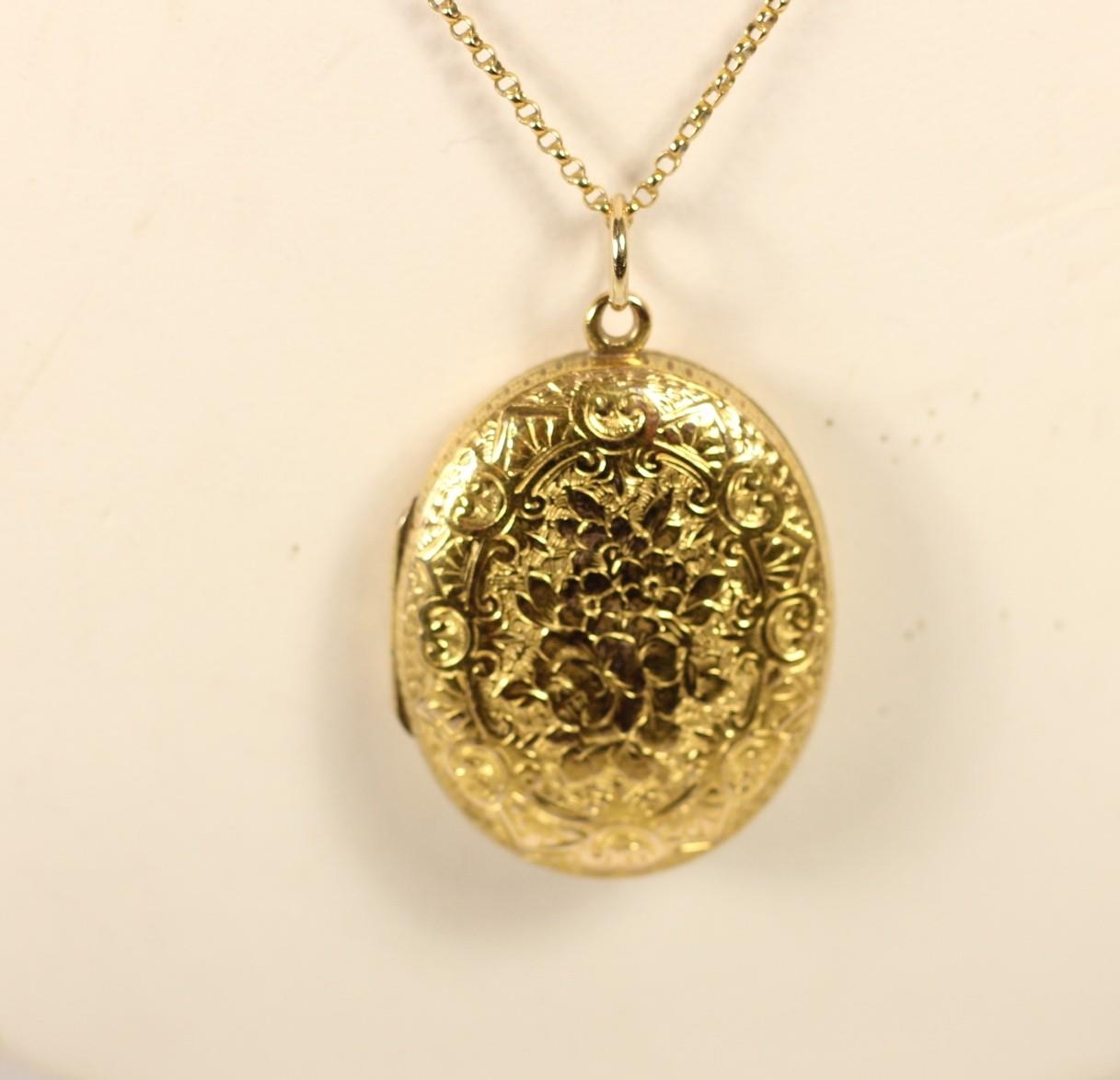 A 9ct gold and opal pendant and a 9ct gold back and front locket, 9ct chain.