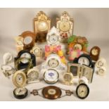 A collection of clocks to include, a Royal Albert 'Country Roses' clock, a Roger Lascelles alarm
