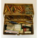 A box and contents of fishing tackle to include, lures, weights, line, bobber's, beads, etc.