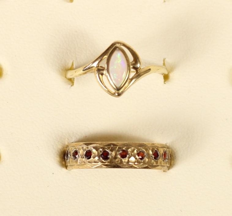 A 9ct gold and opal ring, O, a 9ct gold band ring, N 1/2, 4gm