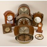 A collection of clocks to include, a quartz Metamec sunburst wall clock, a Staiger quartz wall clock