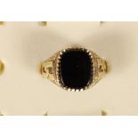 A 9ct gold and onyx signet ring ring, 3.8gm, R