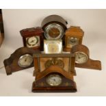 A collection of clocks to include, a Metamec marble & wood effect mantel clock, a quartz clock