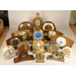 A collection of clocks to include, a blue Metamec electric clock, a Staiger quartz clock, a WM.