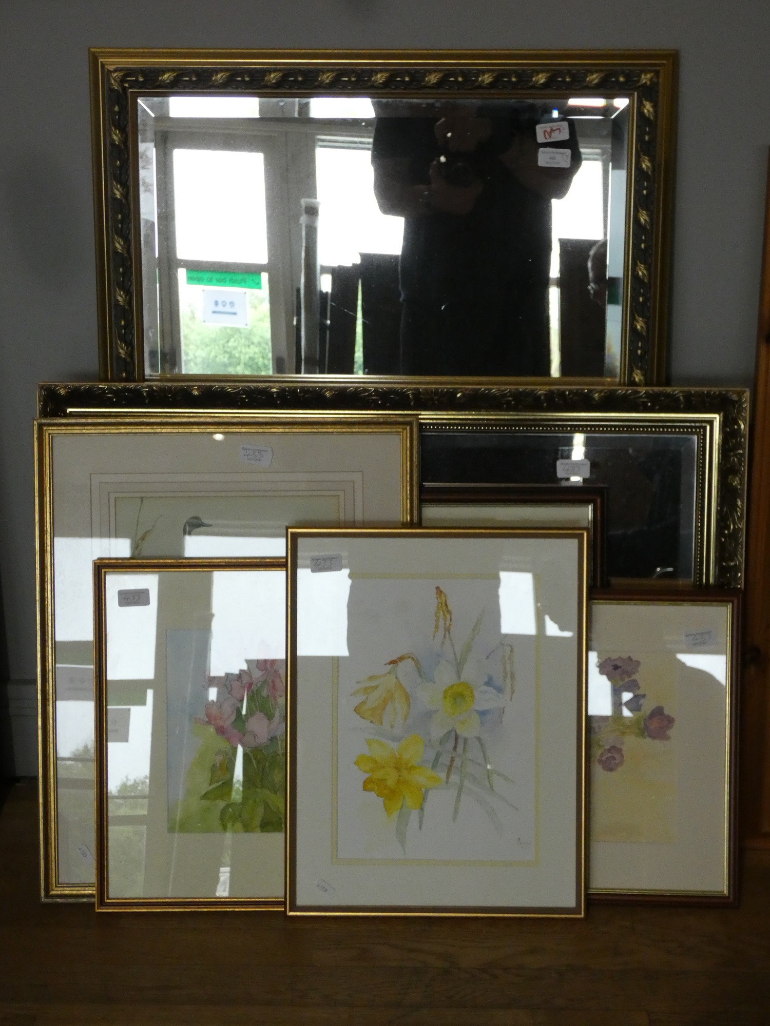 A gilt framed bevel edged over mantle mirror, a smaller gilt framed bevel edged wall mirror. 100 x