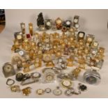 A collection of miniature clocks to include, mantel clocks, vehicles, grandfather clocks, animals