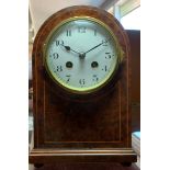 A French mantle clock, in a burr walnut case, the white enamel dial with Arabic numerals, the movem