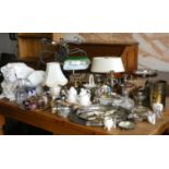 A box of plateware to include, candelabra, serving trays, loose cutlery, together with table