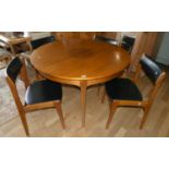 A 1960's Danish teak extending dining table with integral leaf. 121cm diameter, 167cm extended,