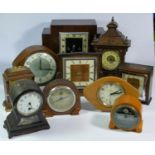 A collection of clocks to include, an English Elegance mantel clock, a Weltime mantel clock,