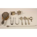 A George III silver caddy spoon, Birmingham 1812, tow pairs of Georgian sugar tongs, two silver