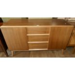A 1960's teak sideboard compromising of, three central drawers flanked by two cupboards with