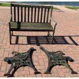 A pair of cast iron bench ends, together with a wooden garden bench (3)