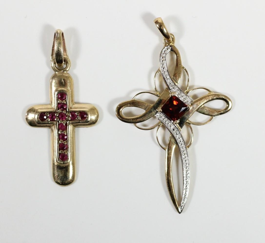 A 9ct gold ruby and diamond cross pendant and a garnet cross pendant, 3.7gm