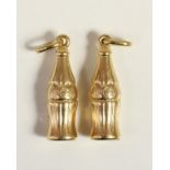 Two 9ct gold Coca Cola bottle pendants, 25 mm, 2.6gm