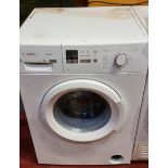 A Bosch Maxx 6 washing machine, together with a Whirlpool clothes dryer - AWZ7913, and a Sharp TV/