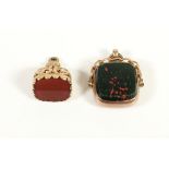 An Edwardian 9ct rose gold swivel fob, marks worn, bloodstone and cornelian and another 9ct gold and