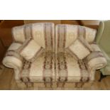 A modern two seater flora pattern sofa. 168cm long.