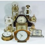 A collection of clocks to include,a Staiger anniversary clock, a Timemaster mantel clock, together