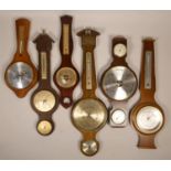 A collection of clocks to include, wall hanging barometers and mantel barometers