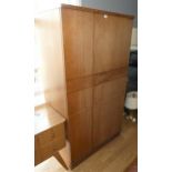 A Mid 20th Century wardrobe with fitted interior and integral door mirror, made by Uni-Flex -