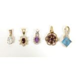 A 9ct gold garnet cluster pendant and 4 other pendants, 4.6gm