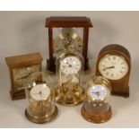 A collection of clocks to include, a Committi of London mantel clock, a Skeleton mantel clock,