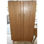 A Mid 20th Century: N. Norman Ltd Of London single wardrobe, with fitted interior. 92cm wide,