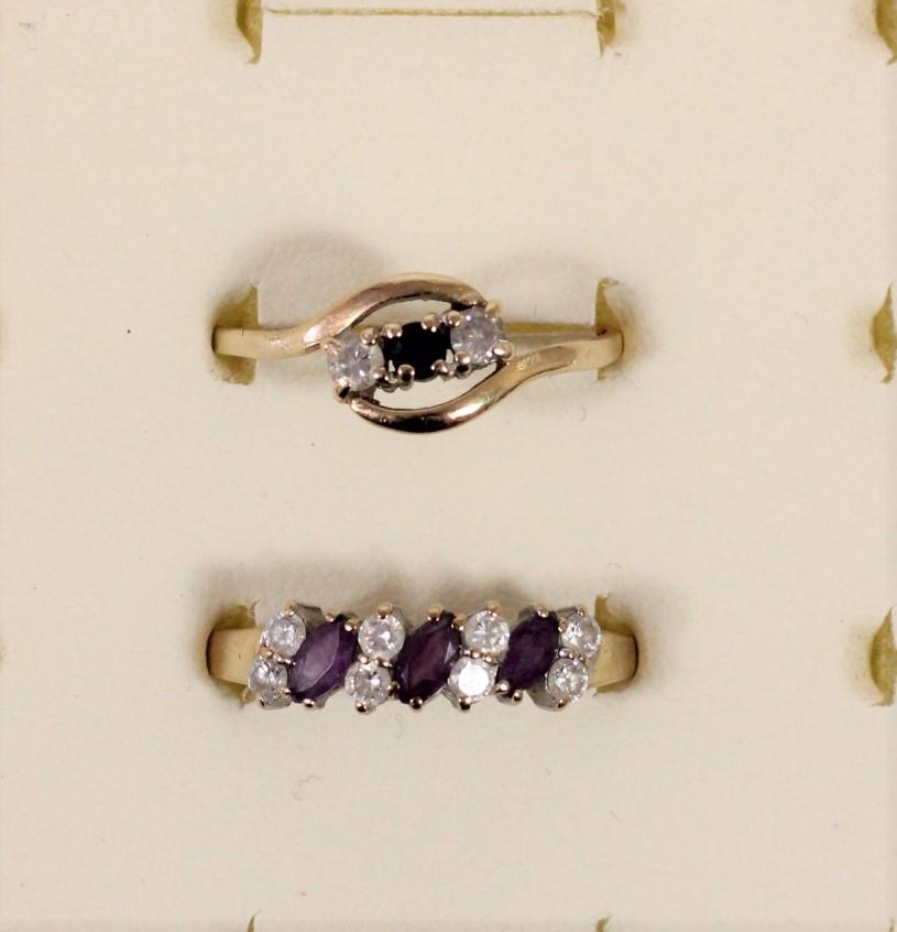 A 9ct gold sapphire and white stone ring, R and a n amethyst and white stone ring T 1/2, 3gm