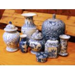 A collection of Chinese blue & white lidded vases and ginger jars to include, an early flower vase